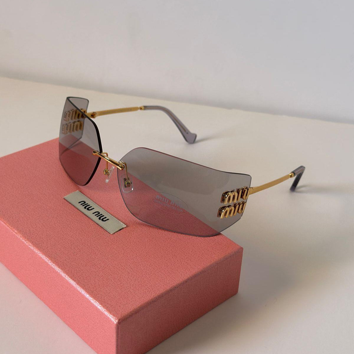 Miu Miu MU 10WS Rimless Shield Sunglasses