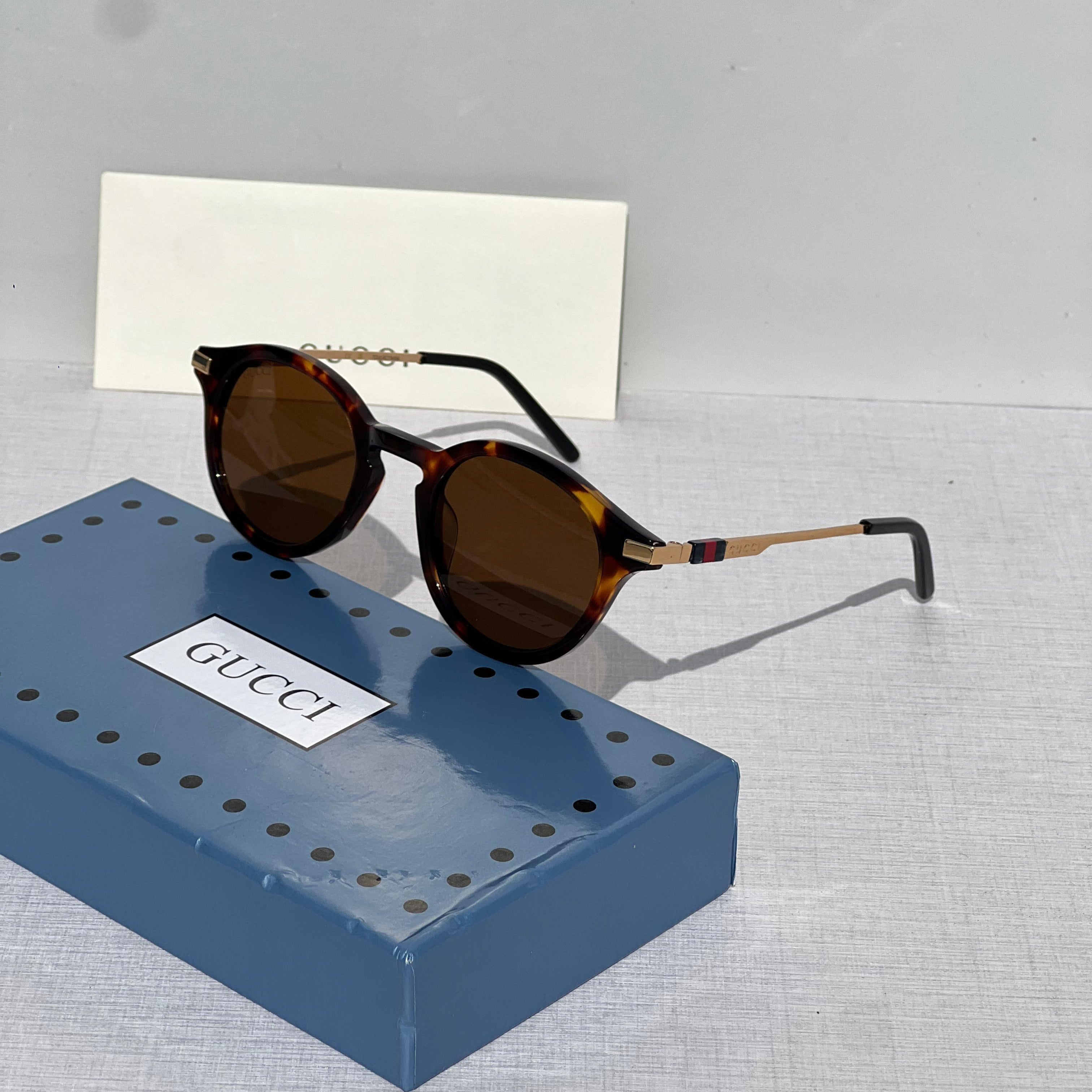 Gucci GG0061S Round Havana Sunglasses